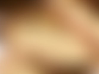 Rustic homemade ciabatta bread with pasta and meatballs in the background