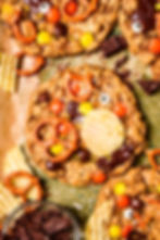Strawberry marble cake slices with white icing and fresh berries on a wooden board, warm rustic dessert close-up.