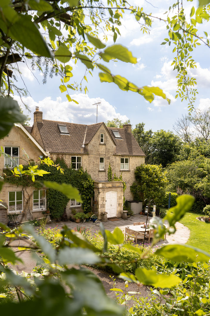 Stately home with formal gardens and mature landscaping photographed in Costwolds by sarah middleton photography
