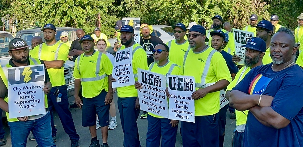 Durham City Workers holding UE Local 150 signs