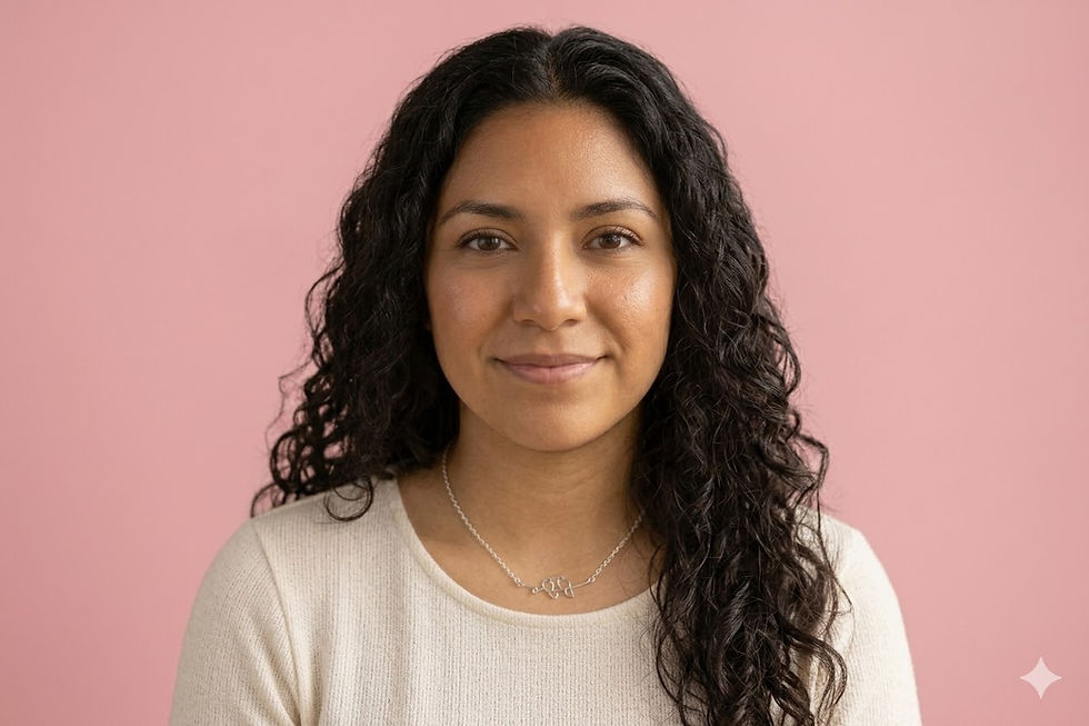 A headshot of a smiling woman wearing a delicate sterling silver necklace featuring two minimalist love birds.