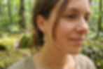 Woman wearing Black-Capped Chickadee Inspired Beaded Earrings in forest