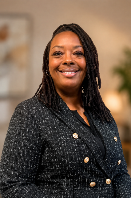 Smiling Black woman with dreadlocks