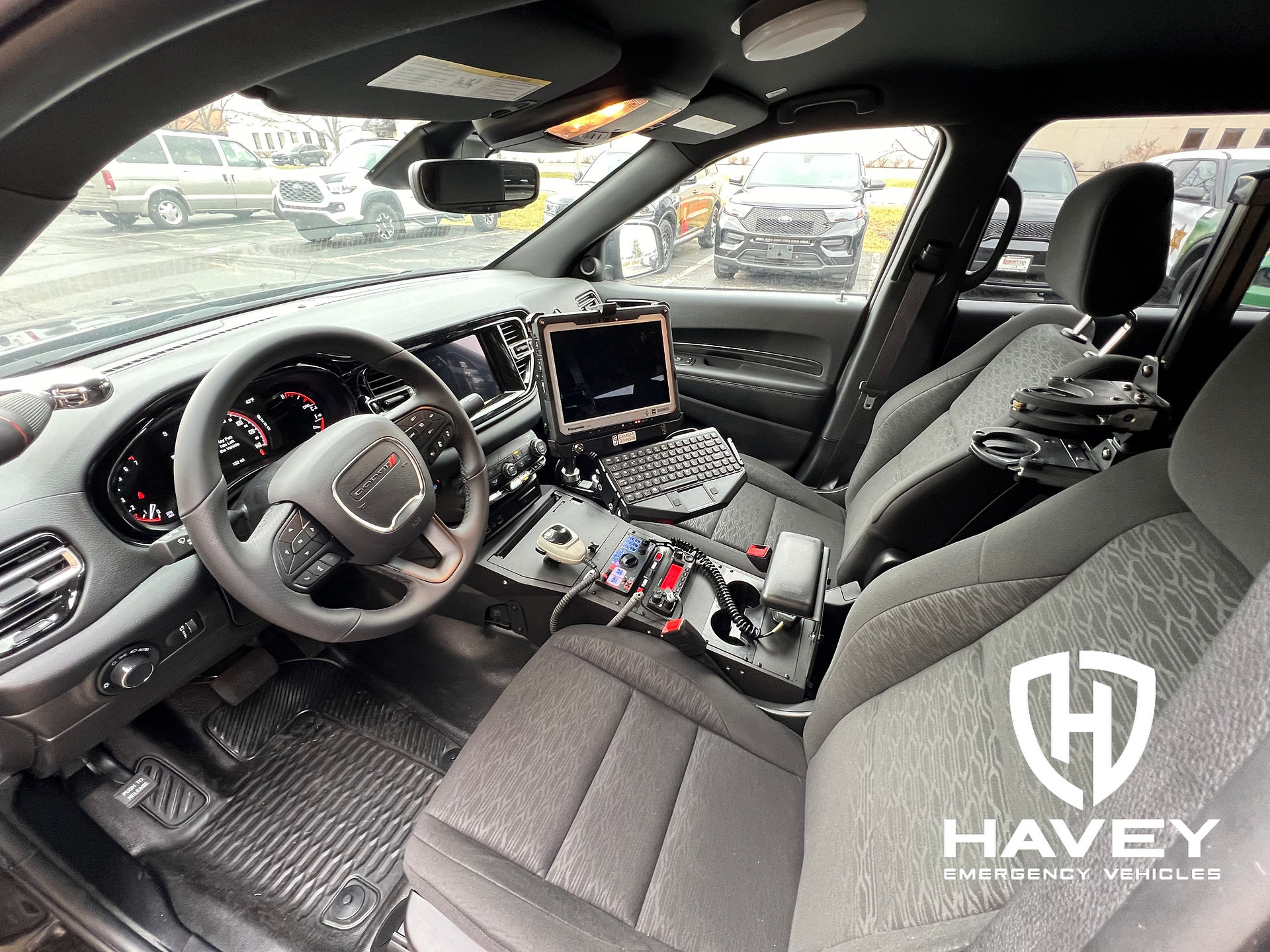 Front seat area of a 2024 Dodge Durango Pursuit with Jotto Desk console.