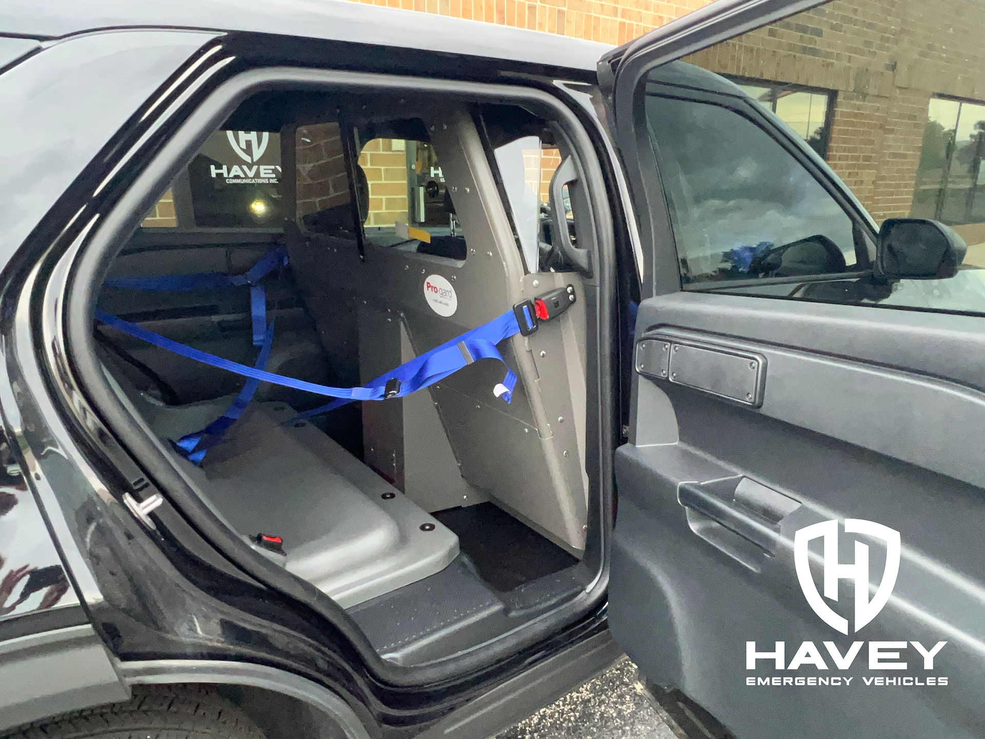 2023 Ford Utility Pro-gard prisoner transport system with front partition, replacement rear hardseat and outboard seatbelt kit.