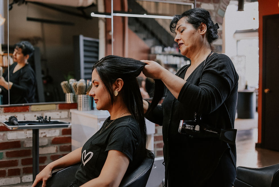 Photo of a woman getting her hair styled