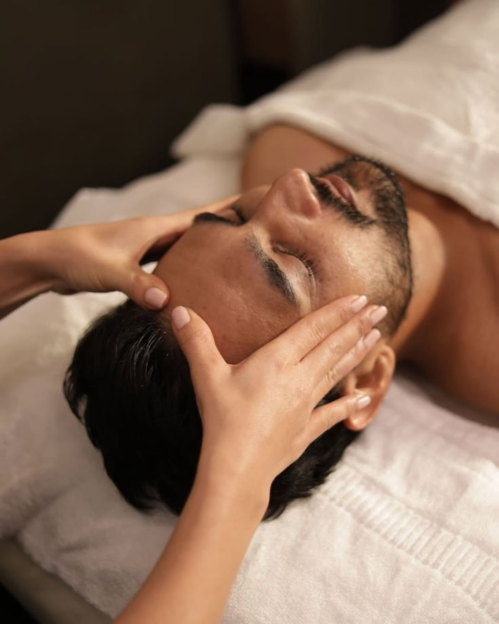 Photo of a man getting a face massage