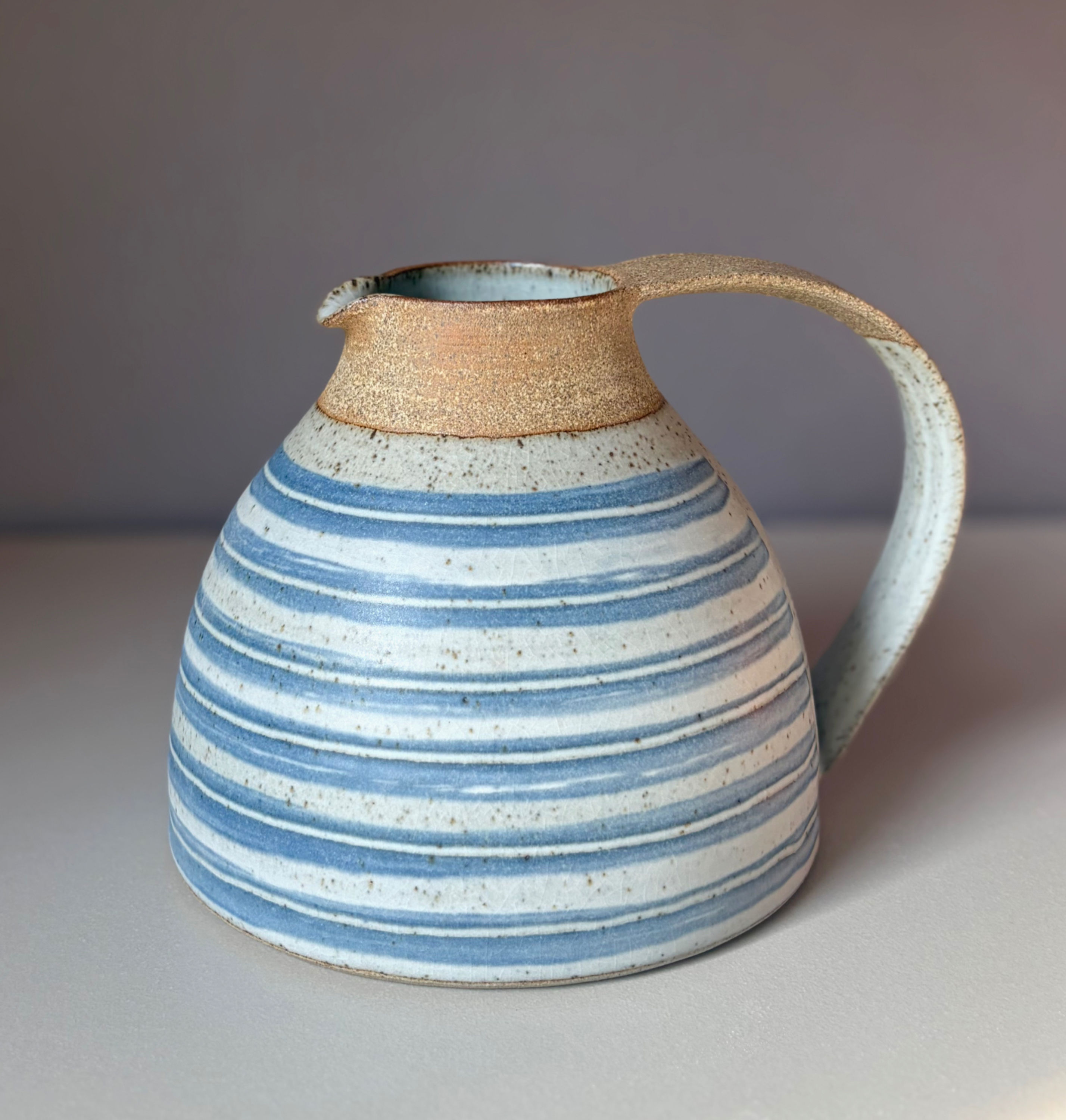 Stoneware Jug in Black slip and a mushroom glaze
