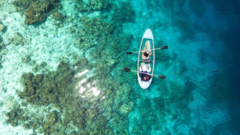 boat-clear-water-kayaking-aerial-view-oc