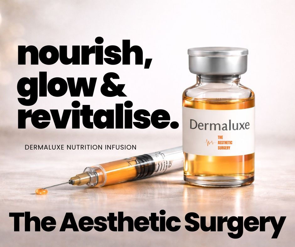 Vial and syringe of orange liquid labeled Dermaluxe with text "Nourish, glow & revitalize. The Aesthetic Surgery." Clean, modern setting.