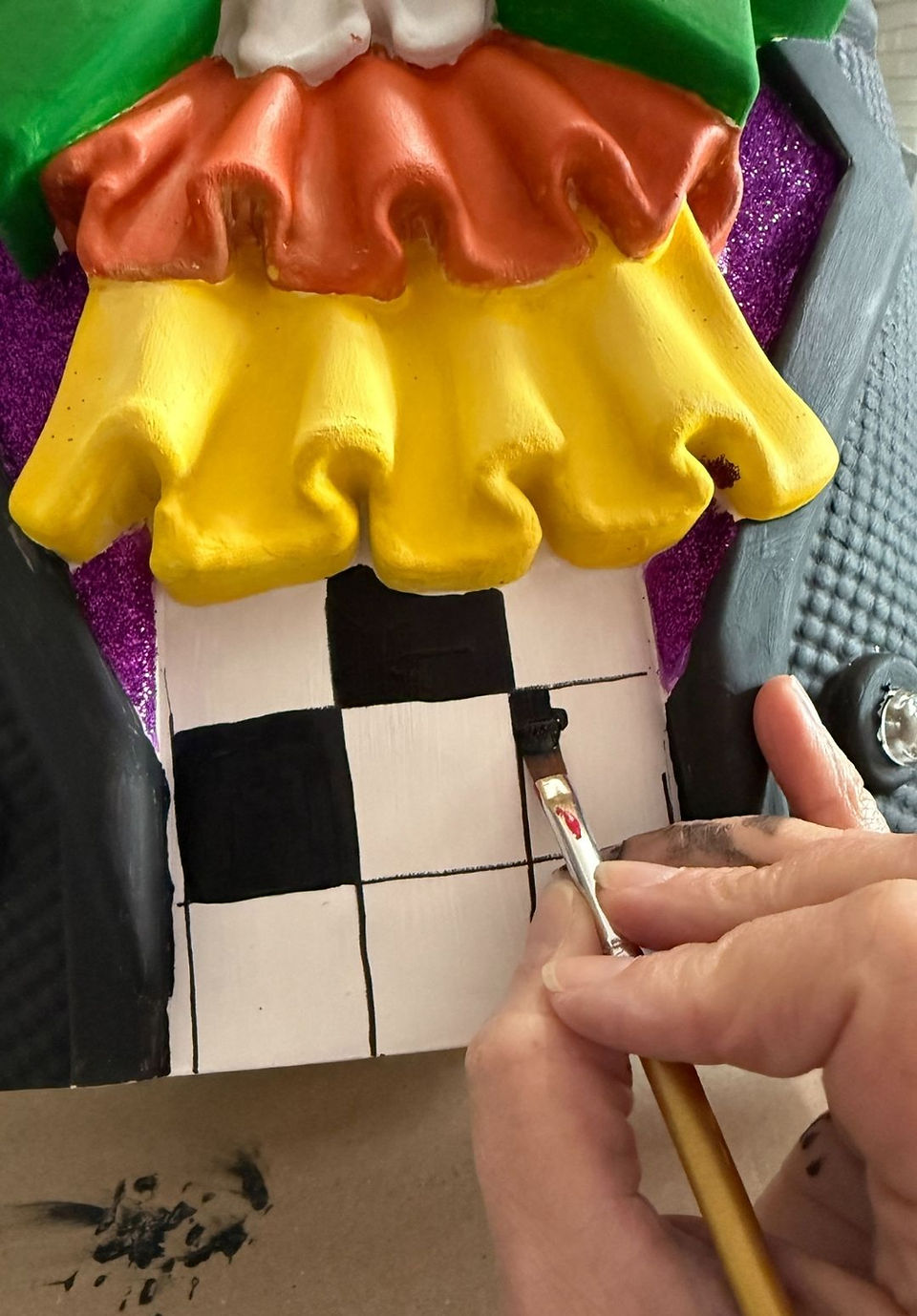 black and white checkered shirt on giant pumpkin nutcracker