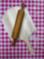 wooden rolling pin and bread board