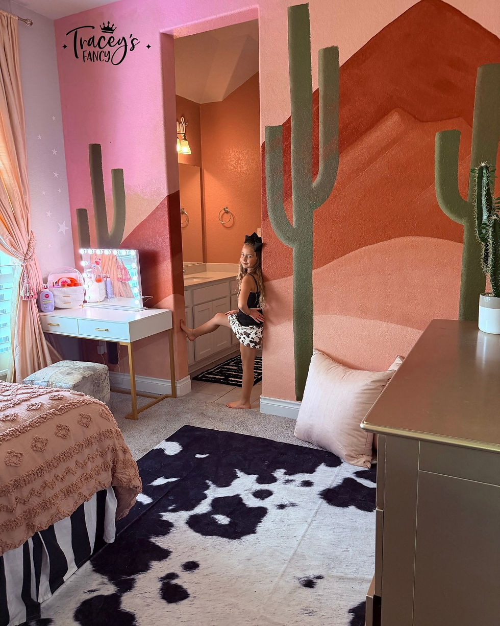 Little girl standing in a doorway admiring her easy DIY Desert Wall Mural by Traceys Fancy