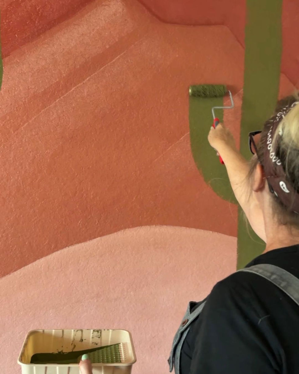 rolling the cacti on the easy diy desert wall mural