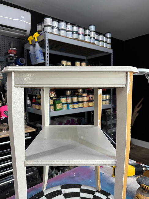partially painted thrifted side table with white paint