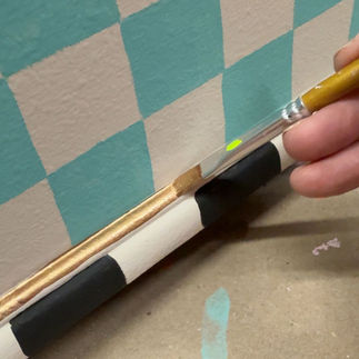 painting gold highlights on whimsical thrifted box