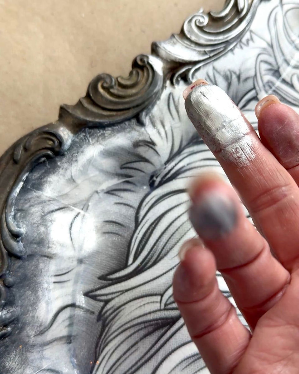 finger applying silver gilding wax on Santa Serving Tray