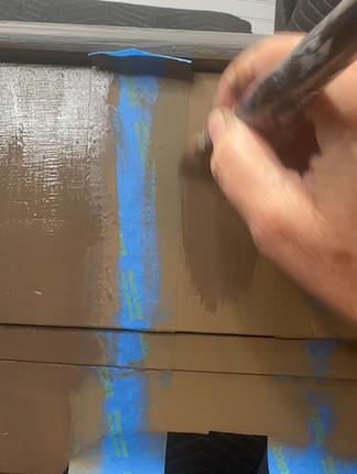 painting a darker brown stripe on front of writing desk