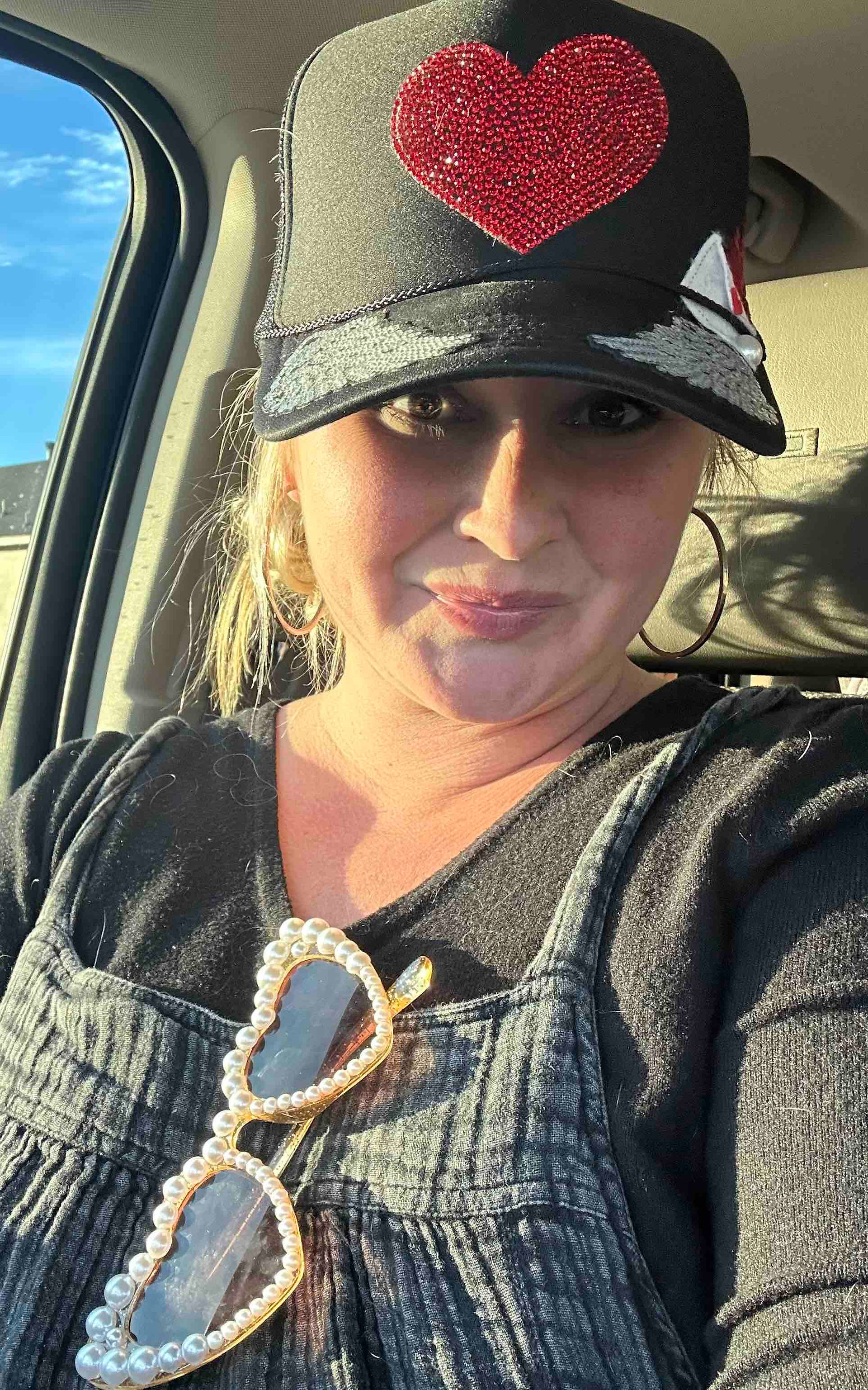 woman wearing custom heart trucker hat