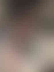 a whimsical pepper grinder painted with white, teal, and pink checks