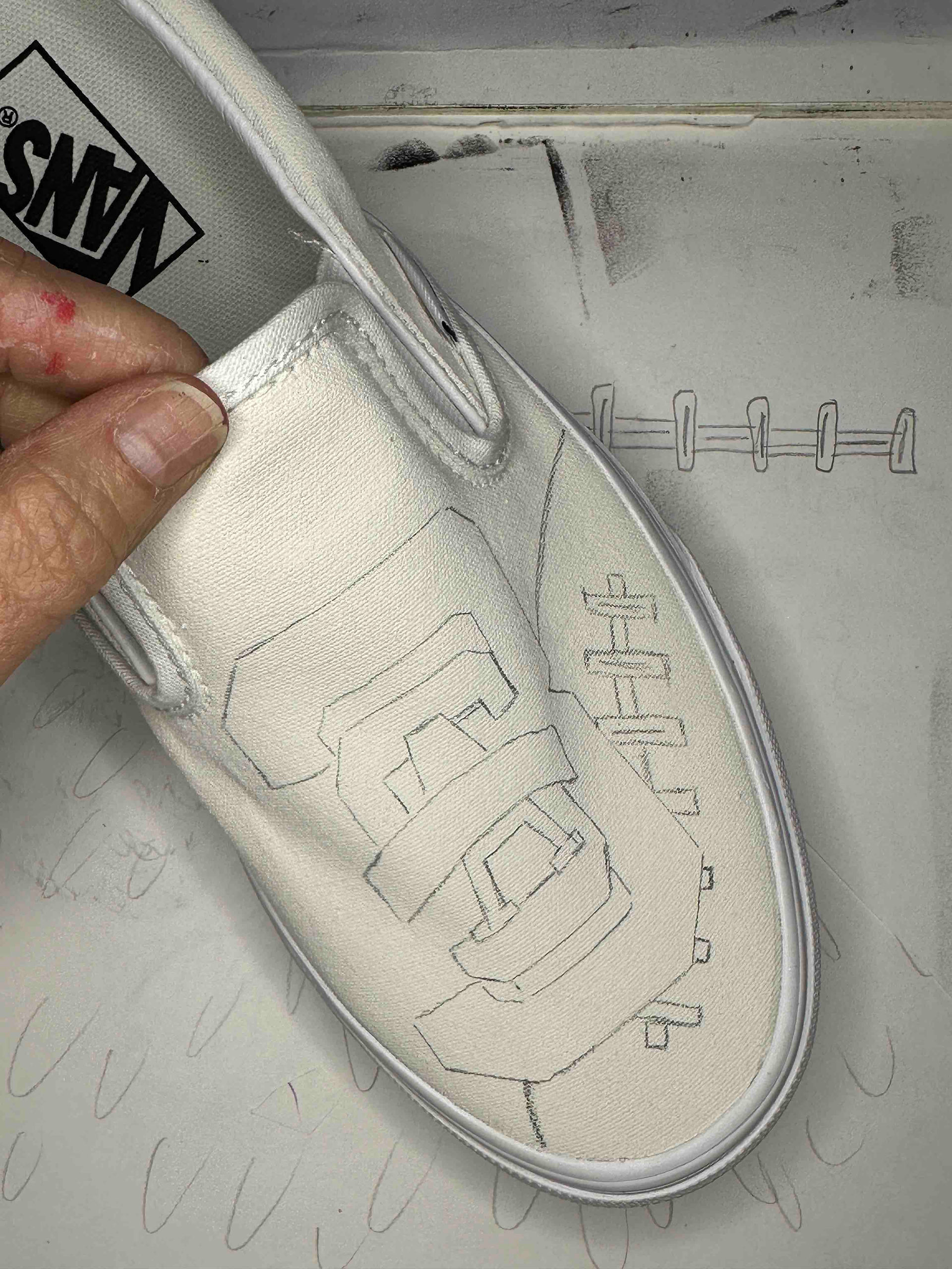 Tracing design sketch to front of Van shoe