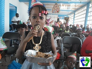 Ebolas-orphan-Candida-really-enjoying-her-chicken.JPG