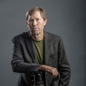 Artist and photographer Peter Cram posing for a moody artist portrait