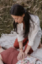 Gentle touch used with consent during a one-to-one somatic session.