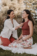 Gentle touch used with consent during a one-to-one somatic session.