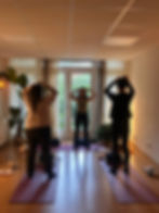 Participants exploring breath and body awareness during a group somatic session.
