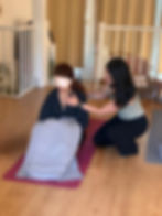 Gentle touch used with consent during a one-to-one somatic session.