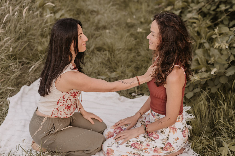 Gentle touch used with consent during a one-to-one somatic session.
