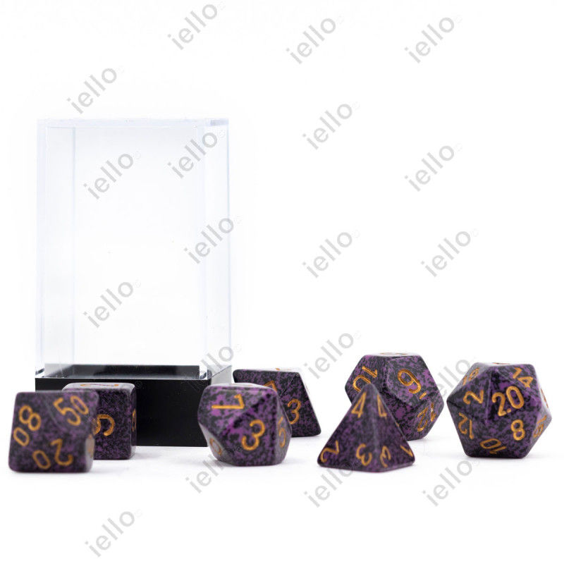 Boite de sept dés de la marque Chessex, dés de couleur violet et or. Ces dés sont texturés.