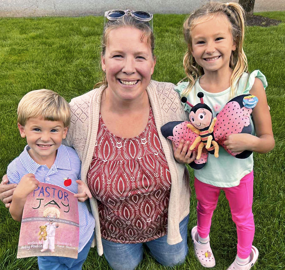 Woman with two kids smiling on grass. Boy holds a book titled Pastor, girl hugs a pink butterfly plush. Sunny day, joyful mood.