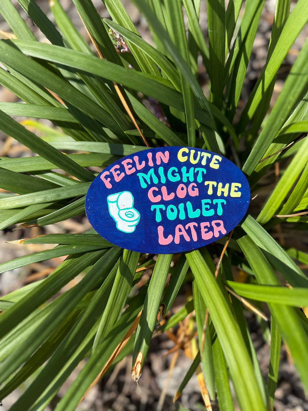 hand-painted "Feeling' cute might clog the toilet later" magnet displayed on a plan