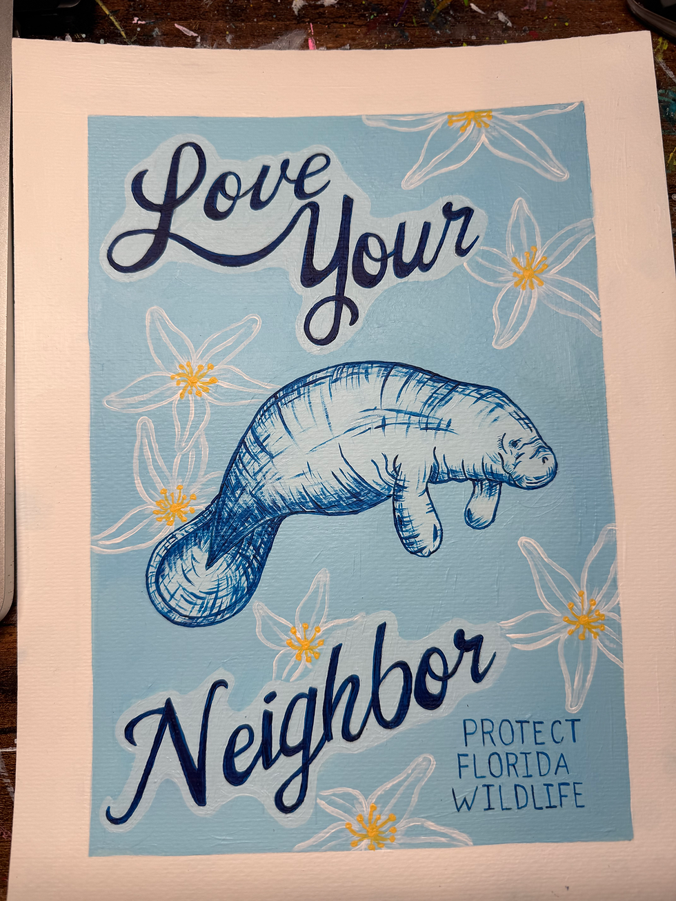 painting of a manatee that says "love your neighbor" and "protect florida wildlife"
