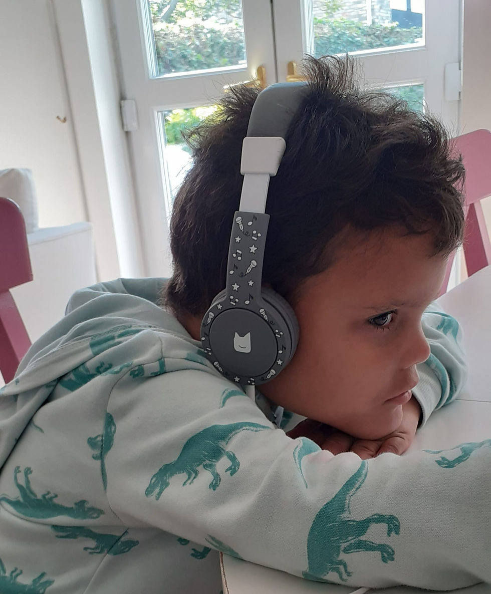 Luis wearing Tonies headphones