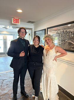 kj eventures wedding planner and coordinator standing with bride and groom