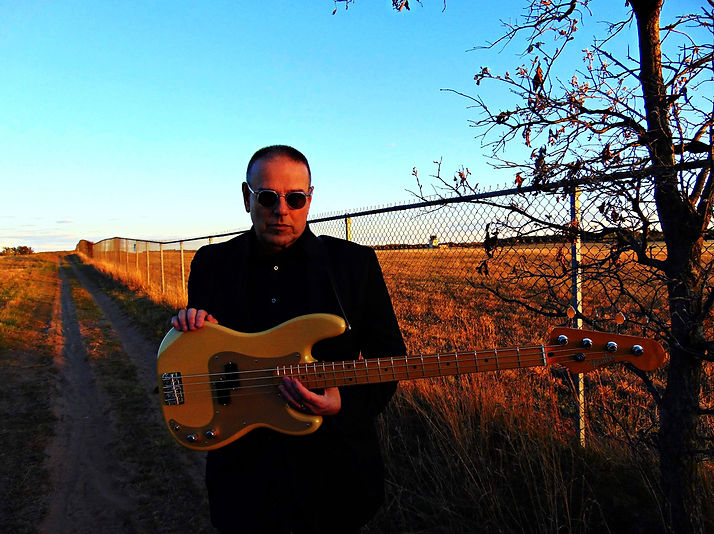 Peter Phippen holding Fender bass.