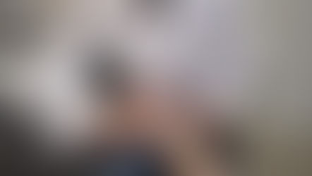 physician consulting with a patient, reading pulse