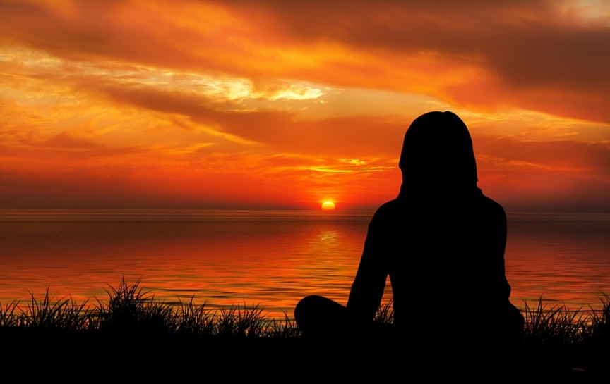 Self care person watching sunset