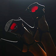 Sophie Atlan is wearing black Pole Dance Heels with red hearts.