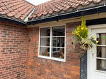White aluminium windows on bungalow 