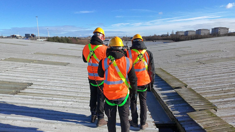 roofers on top of industrial roof 