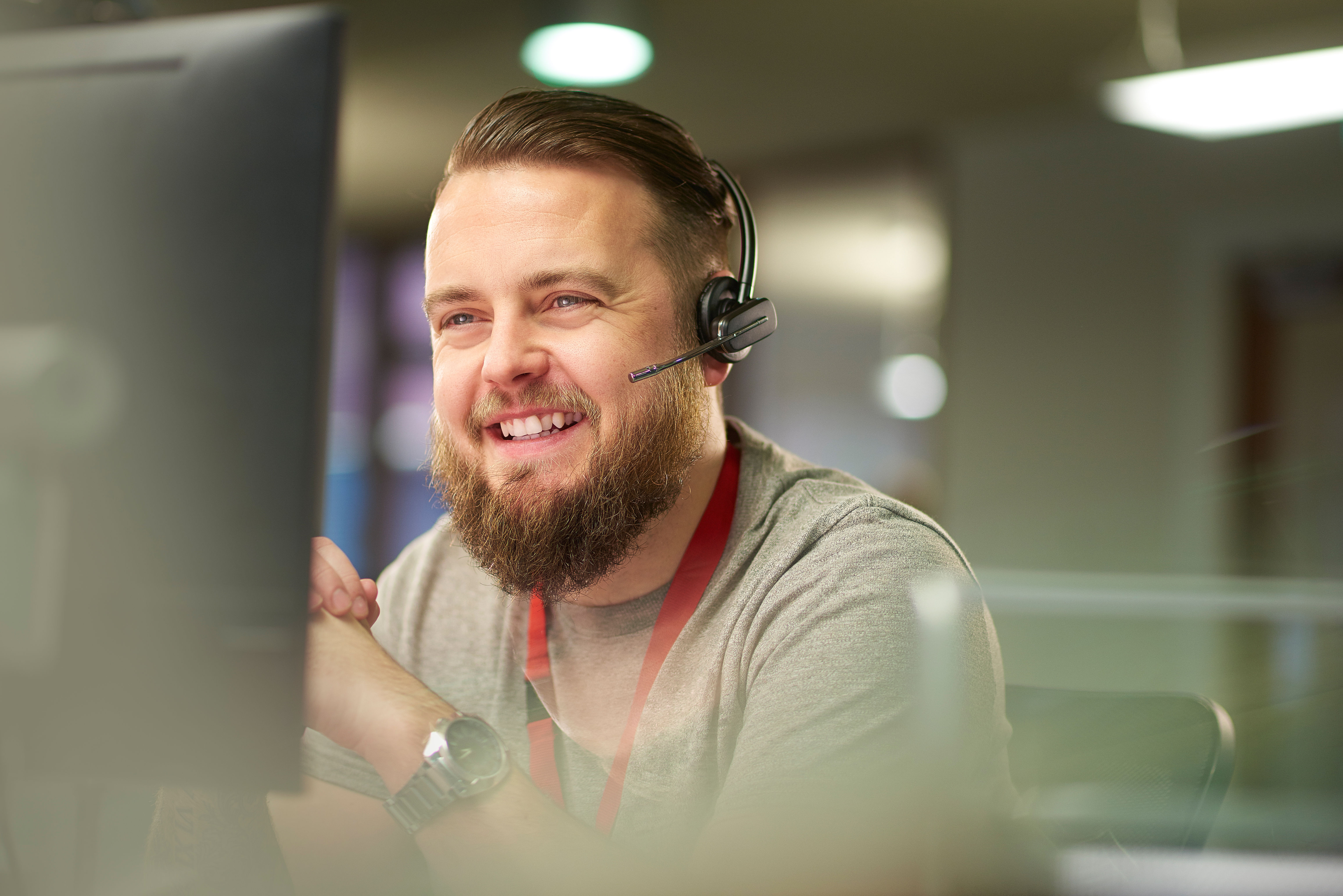 Person in call centre with headset on