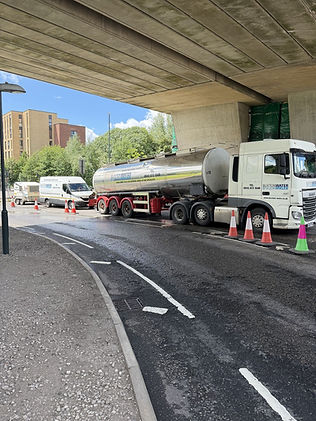 Buxton water vehicles parked on side of the road