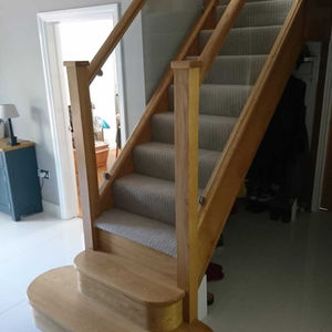 Wooden staircase with glass inserts