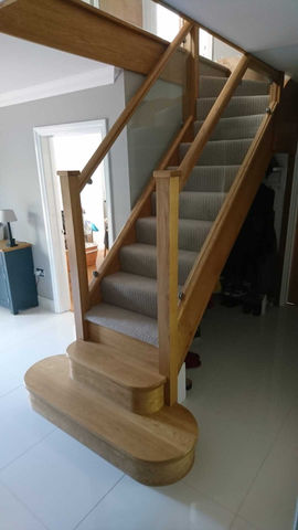 Wooden staircase with glass inserts 