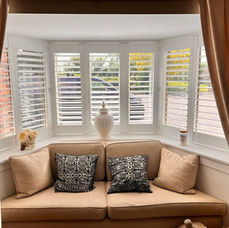 Made to measure shutters and curtains fitted on bay window
