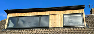 Black aluminium windows  on roof conversion 